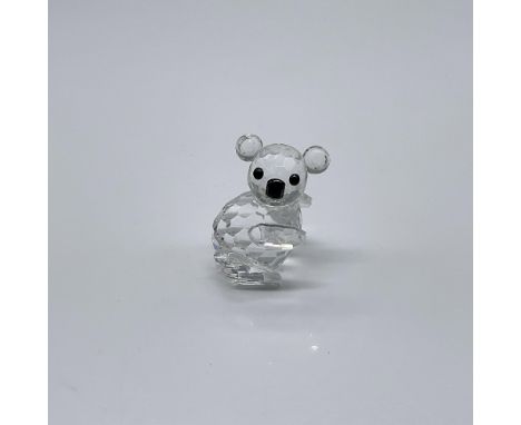 Part of the Endangered Species collection. A tiny clear crystal marsupial, facing right, with black crystal eyes and nose. Sw