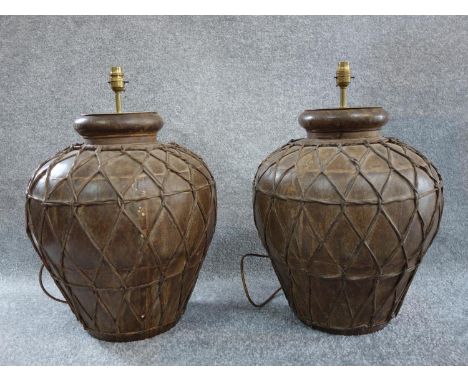 A pair of large Eastern style metal lamp bases. H.48 