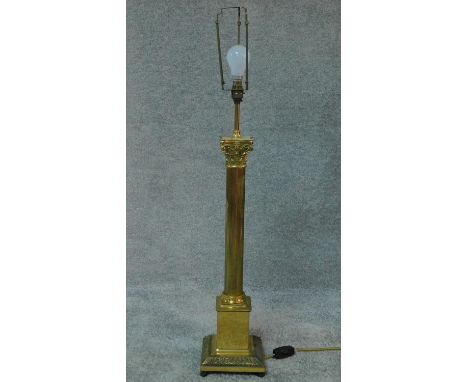 A large brass Corinthian column style table lamp. H.96cm 