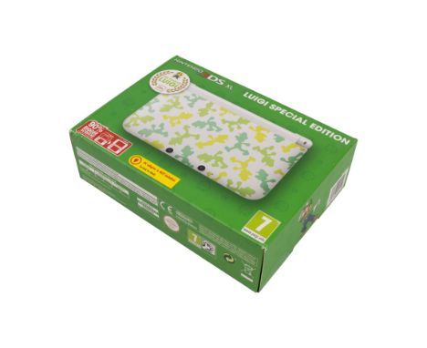 This lot features a brand new, sealed and never been used Nintendo 3DS XL handheld. This is the limited edition Luigi handhel