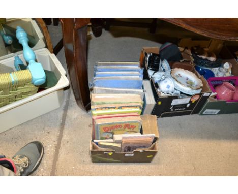 A box containing various books to include vintage annuals and film reviews 