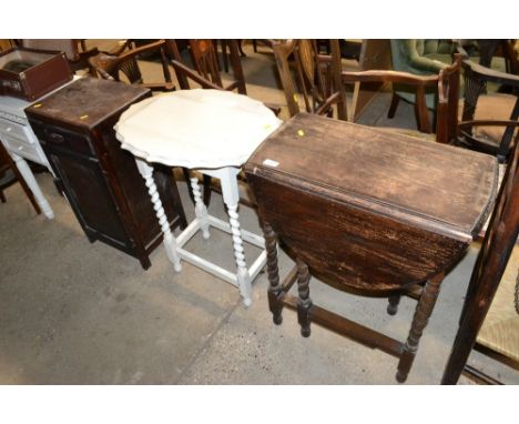 An oak and barleytwist gate leg table and a barleytwist white painted side table and a bedside cupboard fitted single drawer