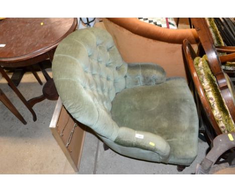 A green upholstered button back nursing chair 