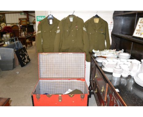 A large trunk full of military uniforms