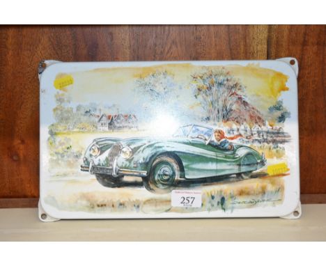 An enamel wall plaque of a Jaguar XK120