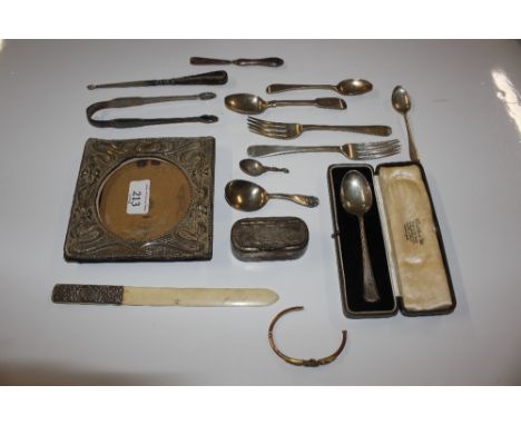 A box containing silver photo frame and various silver cutlery, a silver handled page turner, a gold bangle AF, a cased silve