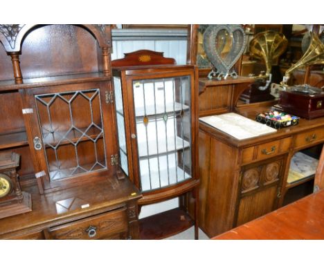 An Edwardian display cabinet with leaded glazed panel 