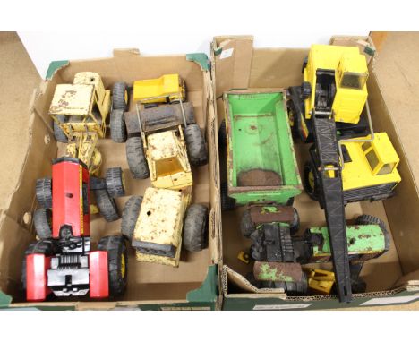 Two boxes of vintage Tonka vehicles including a crane, tractors etc (all with play wear and some rusting)