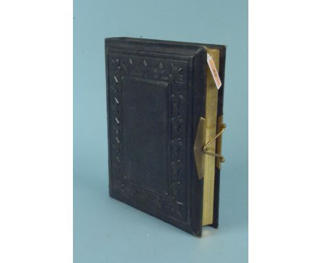A good quality Victorian photograph album, half filled with portrait photos including some military