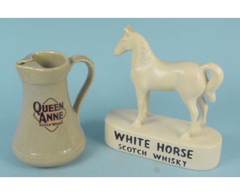 A vintage Kelsboro pottery White Horse scotch whisky horse figurine plus a Wade Queen Anne scotch whisky jug