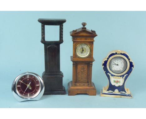 A wooden cased miniature long case clock plus a second with no movement and two other clocks