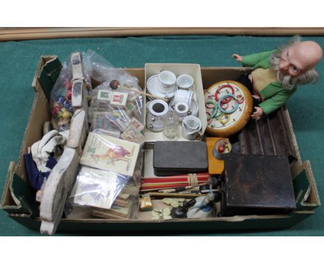 A mixed box of vintage toys and games including some dolls house pieces, dolls etc