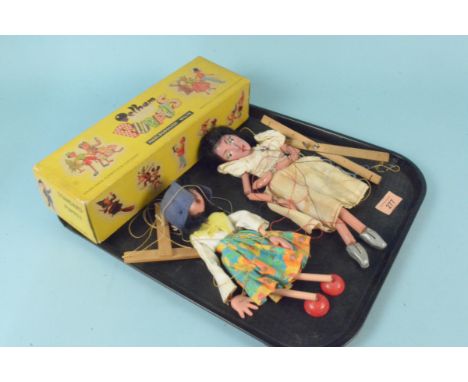 Two vintage Pelham puppets, both female figures housed in one box