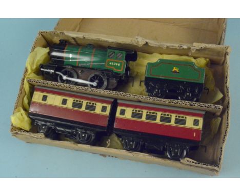 A vintage Hornby clockwork train with tender and carriages