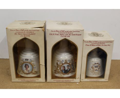 A boxed Wade bells 1986 Queens 60th birthday whisky, a boxed 1986 Andrew and Fergie marriage commemorative and a smaller 1982