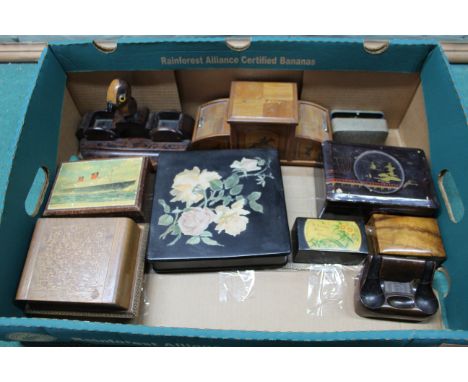 Various wooden boxes, cigarette dispensers, a pen stand mounted with a bird, unusual sofa shaped ashtray etc