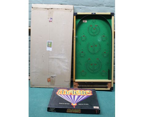 A Kay of London bagatelle board plus a boxed Magic Tricks set (contents disturbed)