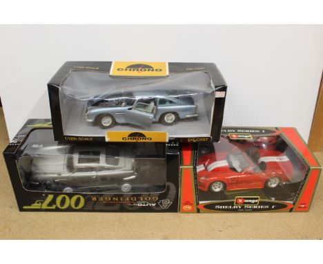 Curon die cast Aston Martin DB5 1/18th scale plus a Burago Shelby Series 1 and an Auto Art James Bond Goldfinger 007 car