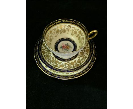 Paragon blue and gold decorated four cups, six saucers and eight side plates.