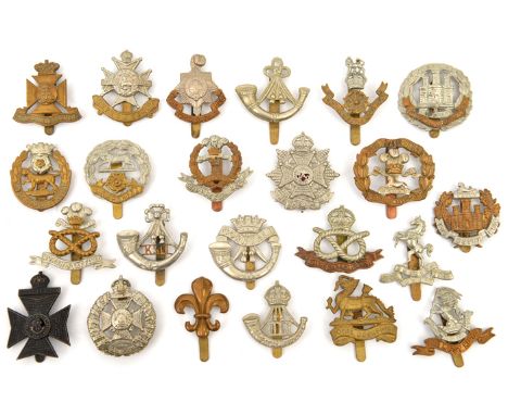 23 different infantry cap badges,  including DCLI, Border, R Sussex, Hampshire, Essex, Notts & Derby, Northants, KSLI, KRRC v