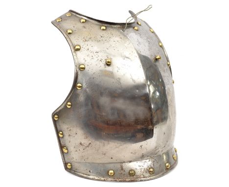A 19th century continental heavy steel breastplate,  the edges with large domed brass studs, and with 2 brass studs for the s