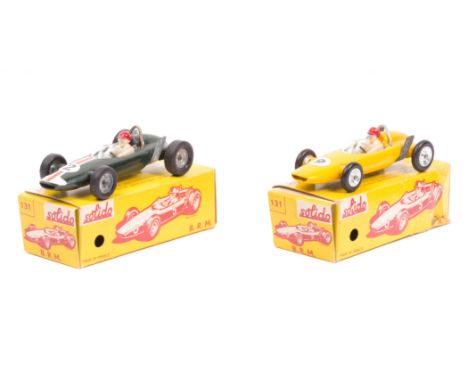 2 scarce Solido single seater racing cars. 2 BRM. One in yellow, RN 9, driver with red helmet. Together with an example in da