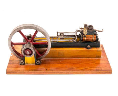 A live steam stationary engine. A single cylinder horizontal engine (cylinder dimensions; 40mm x 70mm). Built to a high stand