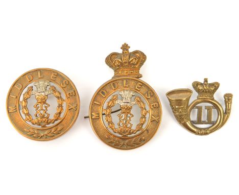 2 Middlesex OR’s  HP centres, one with Vic crown for glengarry, complete with all loops; a Vic crowned bugle cap badge of the
