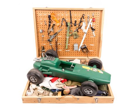 A collection of Action Man clothing and accessories. A Scarce 1960’s Action Man Grand Prix racing car loosely based on a peri