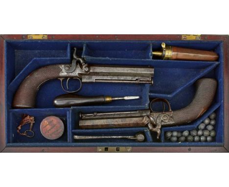 4.25inch sighted octagonal barrels, border and scroll engraved rounded actions, belt hooks mounted on the left side, flared c