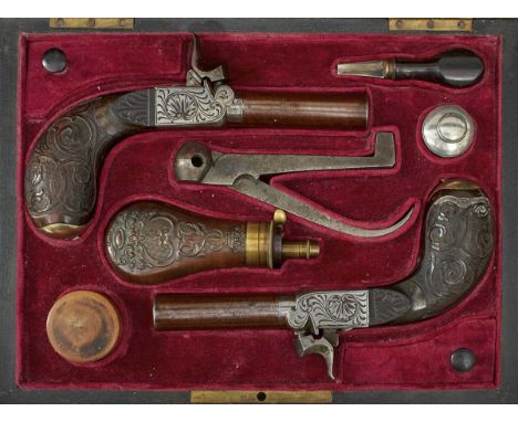 2.25inch turn-off browned damascus barrels, border engraved burnished steel actions decorated with scrolling foliage and scal