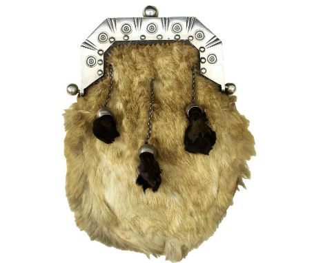 the silver cantle with circle and dot decoration, hallmarked Edinburgh 1898, white fur covered body with the black fur chaine