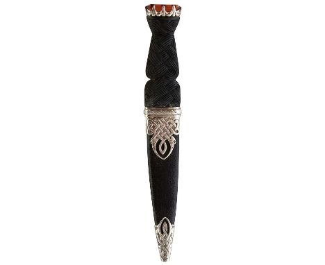 9.25cm fullered blade with faceted back edge, characteristic hilt with carved Celtic strapwork wooden grip, crown pommel set 