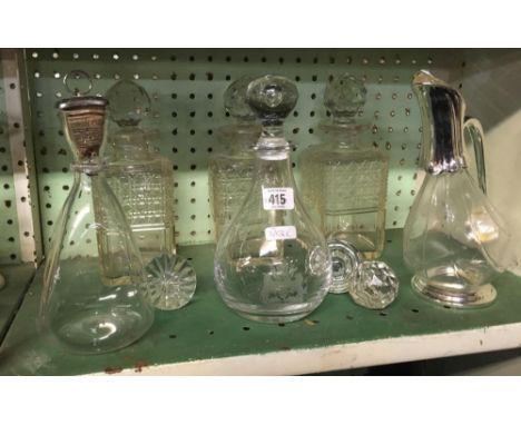 SHELF WITH 3 MATCHING GLASS DECANTERS, 2 CLARET JUGS ETC