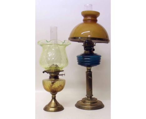 Victorian oil lamp on brass base with Corinthian column and later lamp with green shade. Condition report: see terms and cond