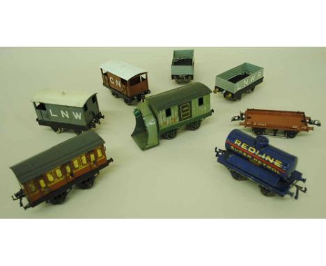 A collection of Hornby Series O gauge rolling stock to include: GW Snow Plough; GN closed wagon; LNW closed wagon; two LNWR o