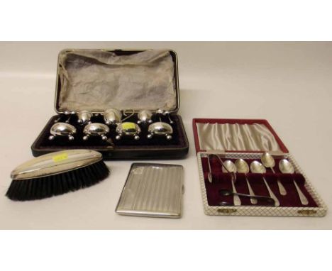 Cased silver cruet set, two silver sugar nips, five silver tea spoons, silver cigarette case and brush. Condition report: see