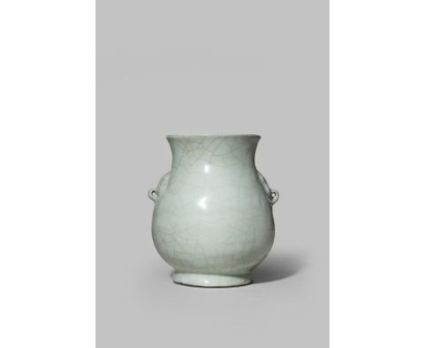 A CHINESE PORCELAIN GUAN-TYPE HU-SHAPED VASE 18TH CENTURY OR EARLIER Of archaic bronze form, the pear-shaped body rising to a