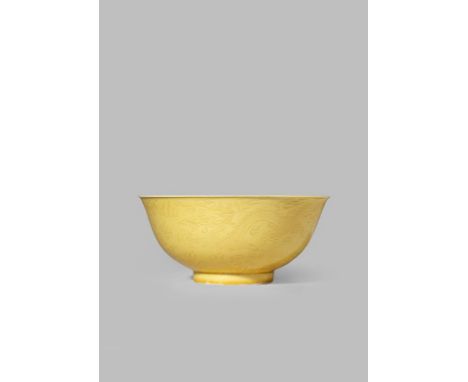 A CHINESE YELLOW GROUND ANHUA 'DRAGON' BOWL PROBABLY GUANGXU The exterior finely incised with a pair of dragons chasing flami
