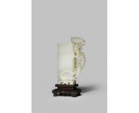 A CHINESE PALE CELADON JADE RECTANGULAR-SECTION VASE QIANLONG 1736-95 Carved in relief with a band of studs bordered by key f