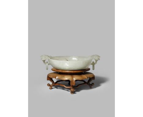 A CHINESE PALE CELADON JADE MUGHAL-STYLE BOWL QING DYNASTY The interior and base carved as concentric rose blossoms in shallo