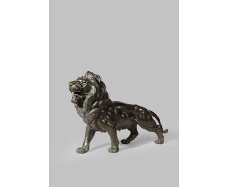 A JAPANESE BRONZE OKIMONO OF A LION MEIJI 1868-1912 Standing four-square with its head raised and baring its teeth, inscribed