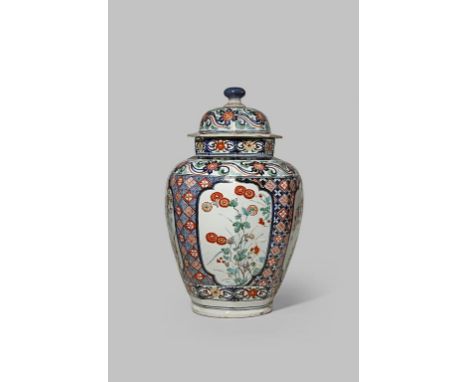 A LARGE JAPANESE IMARI BALUSTER VASE AND COVER C.1700 The octagonal body decorated in underglaze blue, iron red and gold with