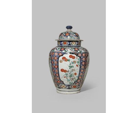 A LARGE JAPANESE IMARI BALUSTER VASE AND COVER C.1700 The octagonal body decorated in underglaze blue, iron red and gold with