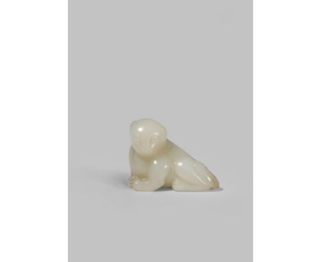 A CHINESE PALE CELADON JADE CARVING OF A DOG QING DYNASTY OR LATER Reclining with its head turned to the side and legs tucked