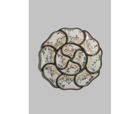 A CHINESE CANTON ENAMEL SUPPER SET 19TH CENTURY Comprising: twelve shaped dishes forming a wheel, decorated with figures in l