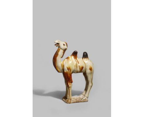 A CHINESE POTTERY FIGURE OF A BACTRIAN CAMEL  TANG DYNASTY 618-907 AD  Standing four-square, his head raised, the straw-colou