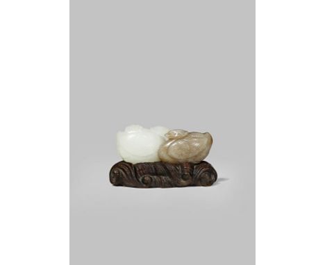 A FINE CHINESE WHITE AND GREY JADE CARVING OF TWO MANDARIN DUCKS  EARLY QING DYNASTY  One carved from the white, the other th