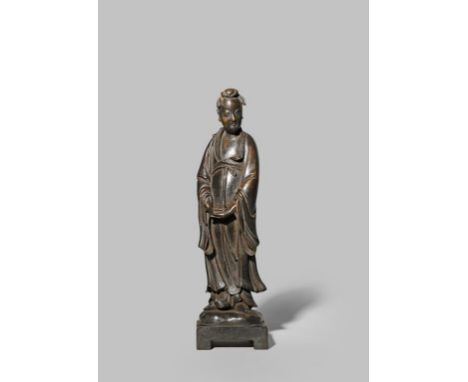 A CHINESE BRONZE FIGURE OF LU DONGBIN LATE MING DYNASTY The immortal stands wearing long flowing robes bordered with lotus he