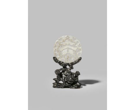 A SMALL CHINESE PALE CELADON JADE RETICULATED PLAQUE QING DYNASTY Carved in the centre with twin fish, a bat and a chime, wit